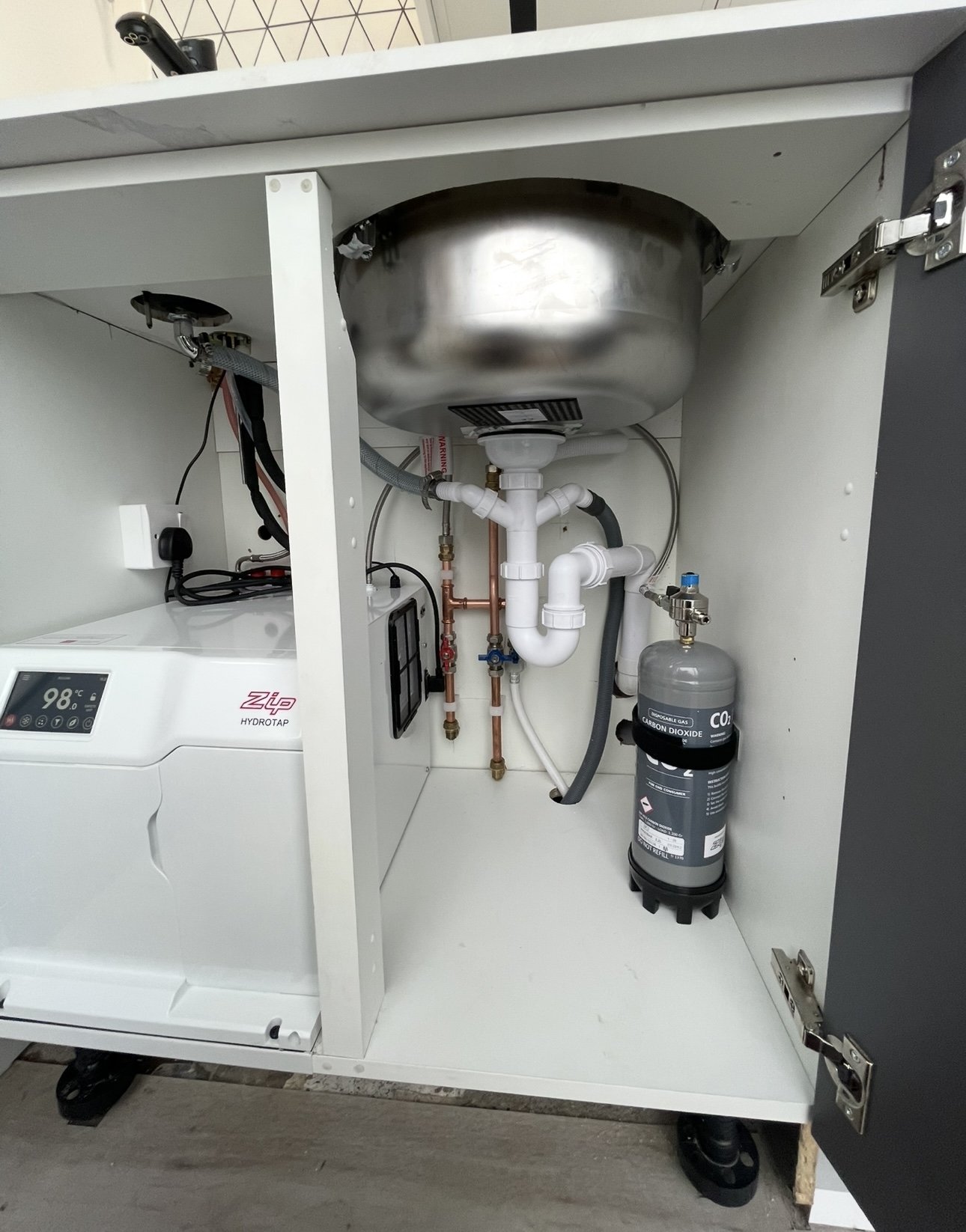 Undersink filtered boiling water tap installation with tidy copper supply pipework by an Edinburgh plumber